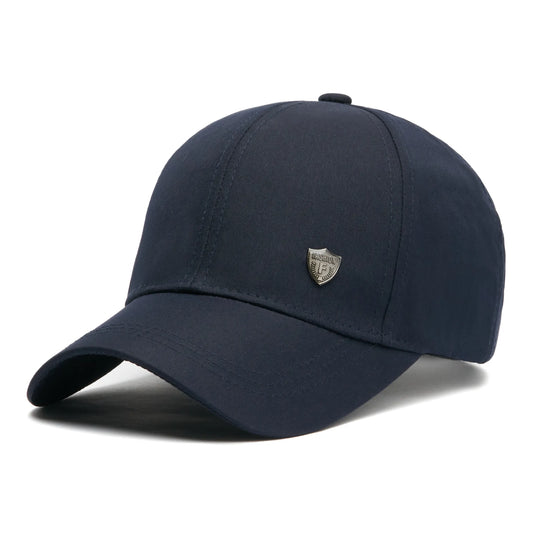 Șapcă bleumarin din stofă, logo metalic Fashion, mărime universală prin cataramă reglabilă.